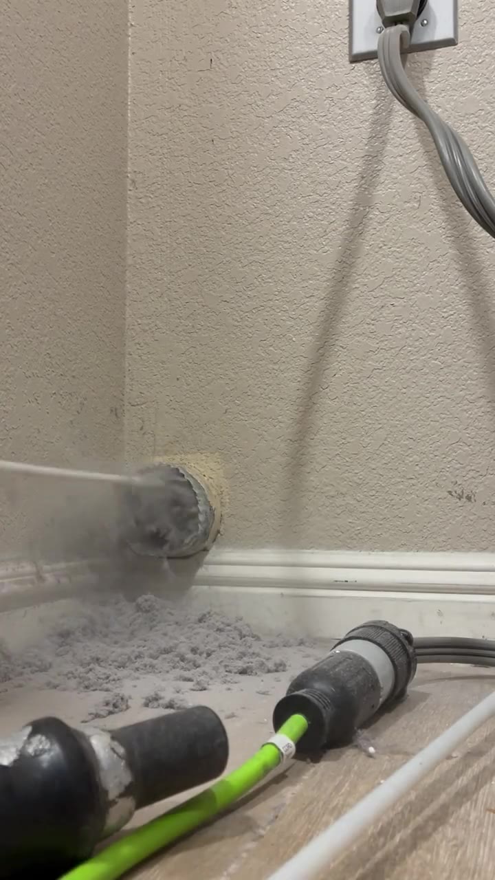 Brush removing lint from an indoor dryer vent opening